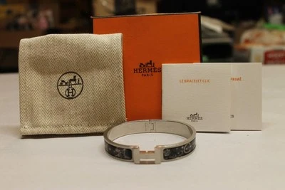 Pulsera Hermes Clic HH C'est la Fete Paladio Cepillado Esmalte Negro Foto 1 de 4