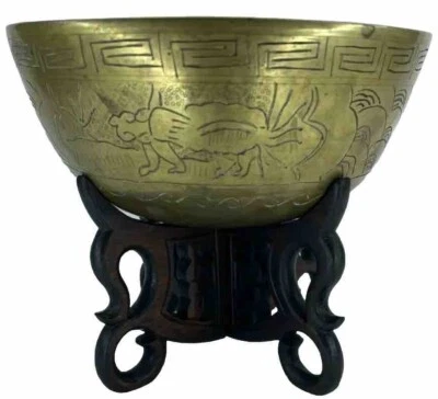 SOLID BRASS BOWL WITH ASIAN CARVING AND WOODEN HAND CARVED STAND - Image 1 of 4