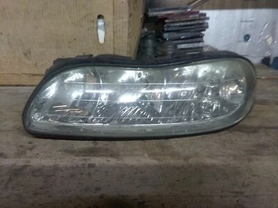 OLDSMOBILE CUTLASS HEADLIGHT ASSEMBLY DRIVER SIDE HAS 2 BULBS OEM 1997-2003 - Image 1 of 4