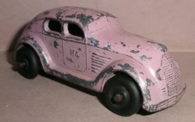 Kansas Toy slush cast car #84  1934 DESOTO AIRFLOW Lavender/Pink, open bottom - Image 1 of 4