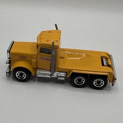 Camión de volteo vintage Matchbox Peterbilt escala 1:80 diecast amarillo ritmo 1981 como está Foto 1 de 4