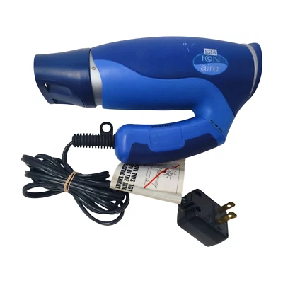 Secador de pelo eléctrico de viaje Igia Ion Aire modelo azul mango plegable funcionando Foto 1 de 4