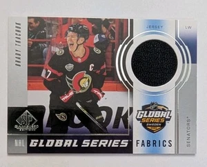 2024-25 CUBIERTA SUPERIOR SP JUEGO USADO SERIE GLOBAL TELAS Brady Tkachuk - Imagen 1 de 2
