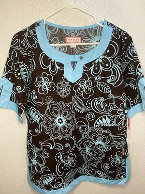 NWT Koi Nursing Scrub Top Women Medium Brown Floral Print Uniform Sky Blue Trim - Image 1 of 4
