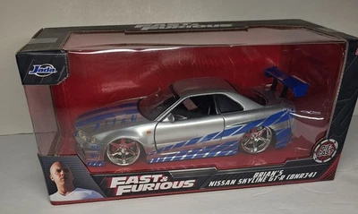 JADA 97158 2 FAST 2 FURIOUS BRIAN'S 1999 NISSAN SKYLINE GT R R34 1:24 SILVER NEW - Image 1 of 4