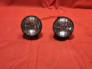 2001 2006 CHEVY TAHOE SUBURBAN ROUND FOG LIGHT LENS HOUSINGS. - Picture 1 of 9