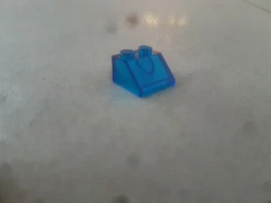 LEGO Slope Brick 2x2 Blue seathrough Piece - Picture 1 of 1