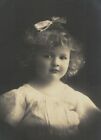 PA2077 FAMOUS 1920 CHILD MODEL SERIOUS LOOKING WHITE BOW IN HAIR REAL PHOTOCARD