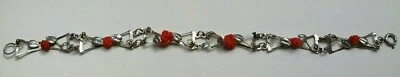 Bracciale semi rigido in metallo argentato con rosette di corallo rosso  Sicilia - Immagine 1 di 3