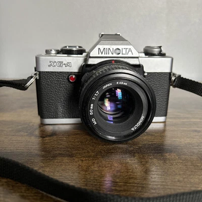 Cámara fotográfica Minolta XG-A y lente 50 mm F/2 MD - LEER Foto 1 de 4