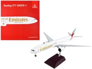 Boeing 777-300ER aereo commerciale Emirates Airlines bianco con coda a righe - Foto 1 di 4