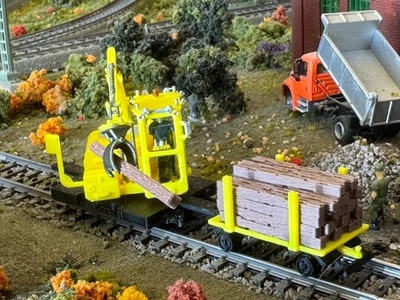Ho scale Cat Railroad Tie Loader with loaded cart in Yellow unpainted - Image 1 of 4