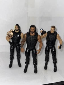 WWE The Shield 3 Pack Bundle Elite Action Figure Roman Reigns, Rollins, Ambrose - Foto 1 di 4