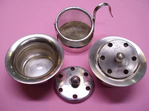 Antiguo juego de plata: tamiz de té con soporte y bolsa de té plateado - Imagen 1 de 1
