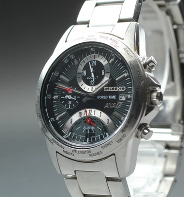 [Casi COMO NUEVO] Seiko ANA World Time 5T82-0AJ0 38 mm cuarzo esfera negra plateada para hombre Foto 1 de 4