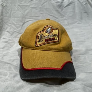 Ron Bundaberg, sombrero/gorra de camionero, espalda a presión, malla ajustable, dorado y negro. - Imagen 1 de 2
