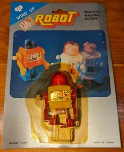 Vintage Taiwan 1980's era wind up robot bootleg/knockoff 2.5" tall, yellow body - Picture 1 of 3