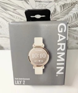 New In Box Garmin Lily 2 Touch Smartwatch 34mm Cream Gold Casing & Coconut Band - Picture 1 of 6