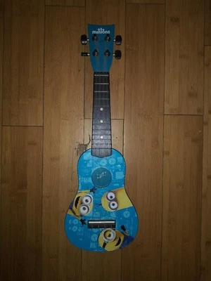 First Act Ukuele For Kids That Love Minions And Music. - Image 1 of 2