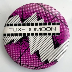 Pin promocional TUXEDOMOON 1980 raro vintage insignia Ralph Records botón de banda de 1,25" - Imagen 1 de 2