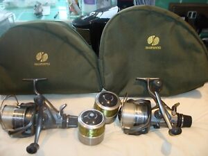 TWO SUPER SHIMANO 10000 XTE BAITRUNNER REELS AND SPARE SPOOLS & CASES