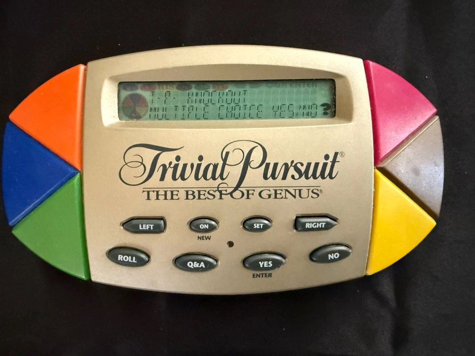 Trivial Pursuit The Best of Genus Electronic Handheld Portable Game 1997 TESTED - Image 1 of 4