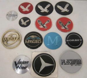 NOS - Odd Lot of 14 Stick-On Emblems for Aftermarket Wheel Center Caps - Picture 1 of 2