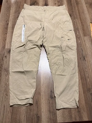 Pantalones Nike, para hombre talla 34, tostados, bolsillo lateral con cremallera, ropa deportiva de 40" de largo Foto 1 de 4