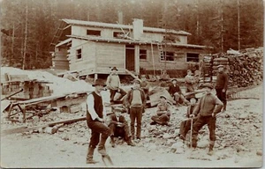 Group of Men Building a House RPPC - Picture 1 of 2