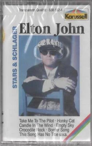 Elton John Stars & Schlager MC NEU Crocodile rock Candle in the wind Border song - Foto 1 di 2