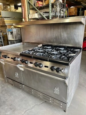 Estufa comercial con 6 quemadores Wolf, plancha y horno doble Foto 1 de 4