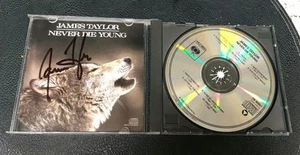 JAMES TAYLOR Signed NEVER DIE YOUNG CD - Picture 1 of 2