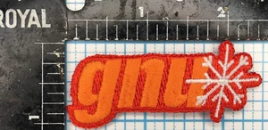 VINTAGE GNU SNOWBOARDS SPORTS ADVERTISING ORANGE 2.5" IRON ON CLOTH PATCH - Picture 1 of 2