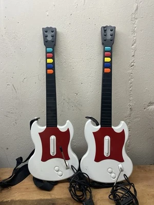 LOTE DE 2 Guitar Hero Playstation 2 PS2 Rojo Negro Octano SG Gibson Guitarras ¡Funciona! Foto 1 de 4