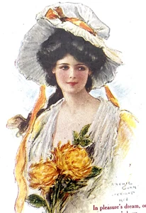 Antigua postal vintage firmada por Archie Gunn 1908 mujer flores amarillas marco dorado - Imagen 1 de 3