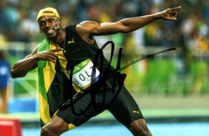 ATHLETICS: USAIN BOLT SIGNED 6x4 RIO 2016 GOLD MEDAL CELEBRATION PHOTO+COA - Picture 1 of 1
