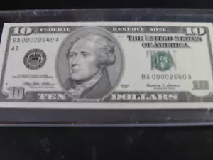 $10.00 federal reserve note series 1999 unc. in a acrylic slider. - Picture 1 of 2