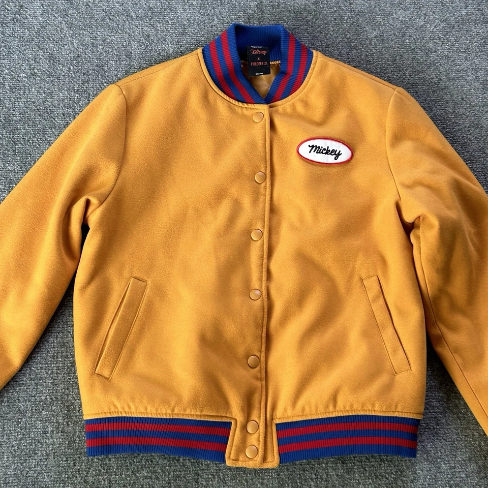 Chaqueta para mujer Forever 21 X Disney pequeña Mickey Mouse bombardero universitario mostaza Foto 1 de 4