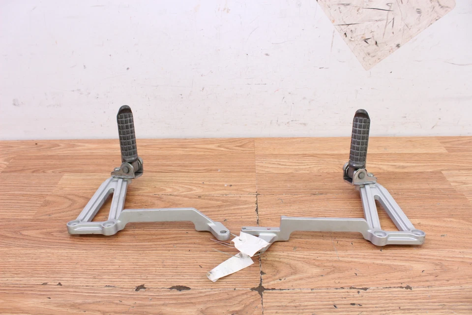 2005 KAWASAKI NINJA 250R Left & Right Rear Exhaust Bracket w/ Foot Pegs - Image 1 of 4