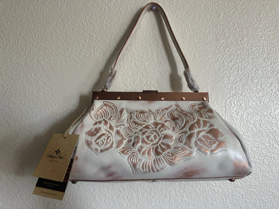 Bolso de hombro Patricia Nash oro rosa Foto 1 de 4