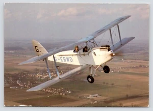 De Havilland DH60 Moth G-EBWD Two Seat Biplane in Flight Continental Postcard - Picture 1 of 2