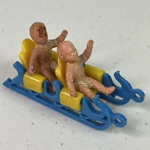 Vtg Miniature Plastic Toy Sled With Two Creepy Children Twin Babies Kids - Picture 1 of 7