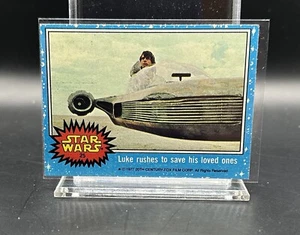 1977 Topps Star Wars Blue #25 Luke si precipita a salvare i suoi cari Jedi Solo Leia - Foto 1 di 2
