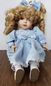 Blonde Curly Haired Girl With Brown Eyes in Blue Dress Sitting 9" Porcelain Doll - Picture 1 of 7