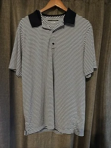 En muy buena condición Greg Norman Play Dry Polo Manga Corta BLANCO NEGRO GRANDE Rayas VEUC - Imagen 1 de 3