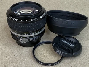 Nikon 50mm F/1.2 AIS Nikkor MF Lens w/ caps , Hood & Filter- MINT - Picture 1 of 10