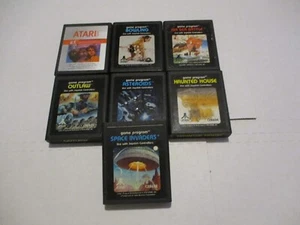 Atari Game Lot of 7, E.T. Space Invaders, Asteroids and More - Picture 1 of 2