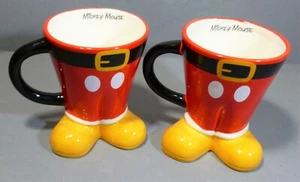 2 X DISNEY CHRISTMAS SIGNATURE MICKEY MOUSE SANTA FEET MUGS COFFEE MUGS - Picture 1 of 6