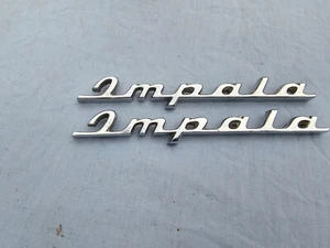 NOS 1960 CHEVROLET REAR QUARTER AND REAR DOOR IMPALA SCRIPTS 3774631 ONE PAIR - Picture 1 of 2