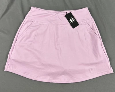 Falda corta de golf FootJoy para mujer tejida aérea pequeña orquídea poliéster spandex precio de venta sugerido por el fabricante 95 USD Foto 1 de 4
